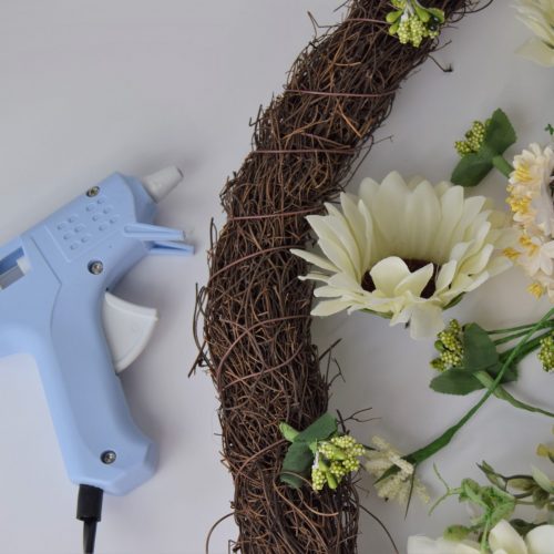 attaching flowers with glue gun
