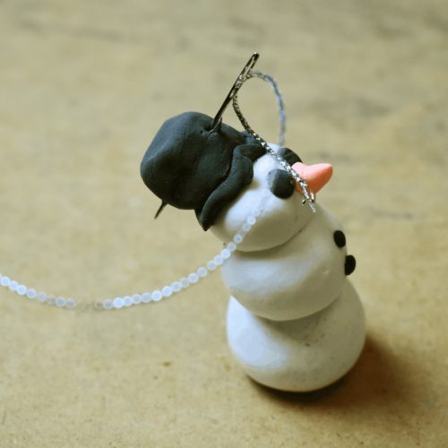 finishing clay snowman
