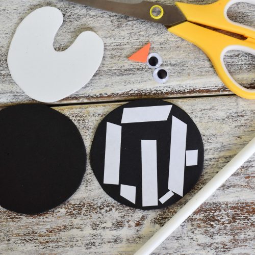 add double-sided tape to make foam penguin