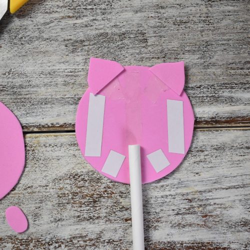 stick ears to the foam pig
